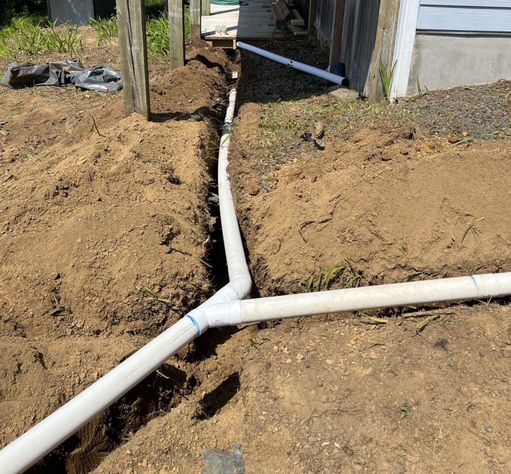 Underground drainage pipes installed to redirect water away from a home's foundation.
