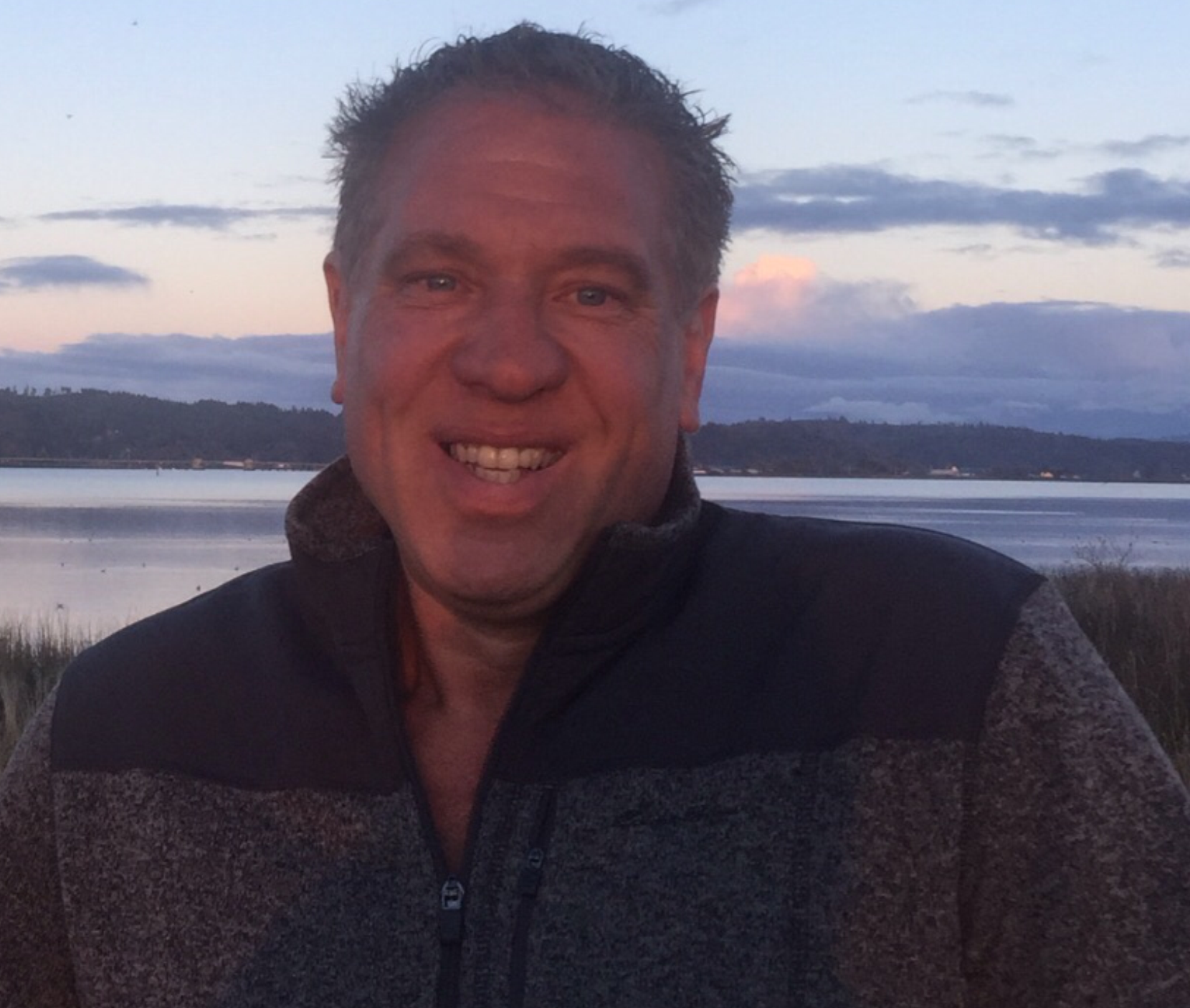 Owner Robert Stineman with Youngs River Bay near Astoria, Oregon in the background